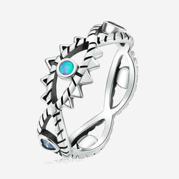Hollow Design Shining Demon Eye silver ring with turquoise and blue gemstones.